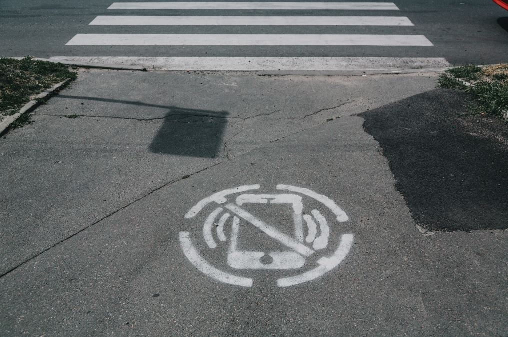no phone sign painted on pavement
