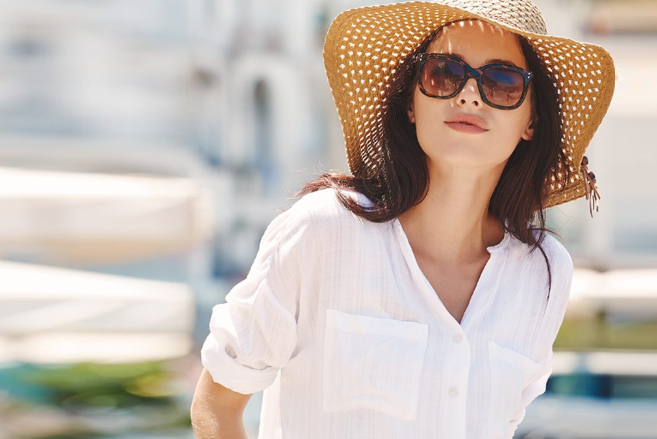 Woman wearing sunhat and sunglasses